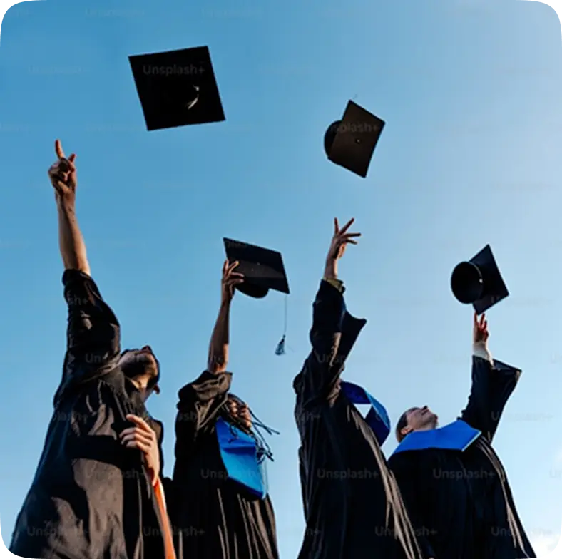 Graduating students throwing caps